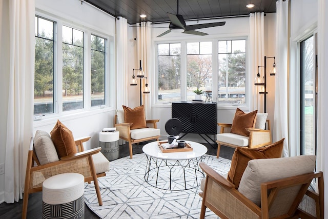 sunroom / solarium featuring ceiling fan