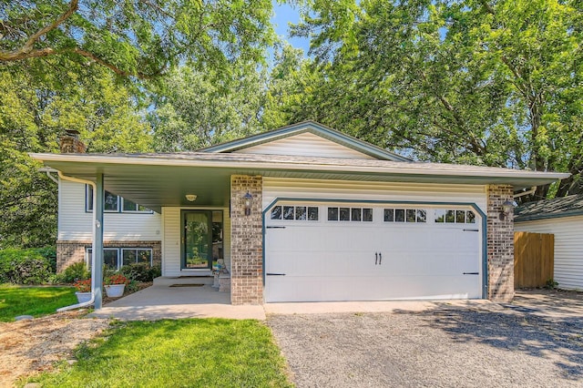 11132 100th Pl N, Maple Grove, MN 55369 - view of front facade with brick siding, driveway, a garage, and a chimney