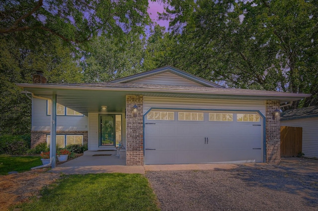 11132 100th Pl N, Maple Grove, MN 55369 - view of front of home featuring brick siding, a garage, asphalt driveway, and a chimney