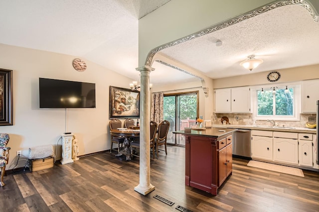 11132 100th Pl N, Maple Grove, MN 55369 - kitchen featuring decorative columns, white cabinetry, dark wood-style floors, a textured ceiling, and plenty of natural light