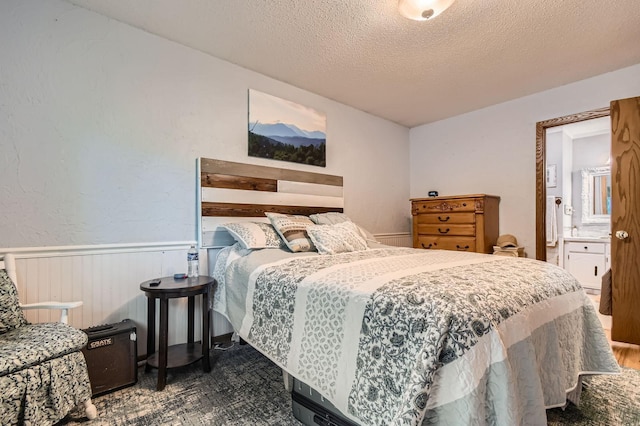 11132 100th Pl N, Maple Grove, MN 55369 - bedroom with wainscoting and a textured ceiling