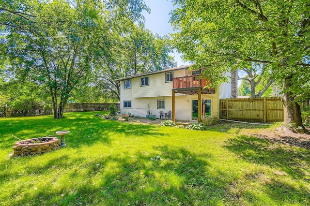 11132 100th Pl N, Maple Grove, MN 55369 - back of house with a fenced backyard, an outdoor fire pit, and a balcony