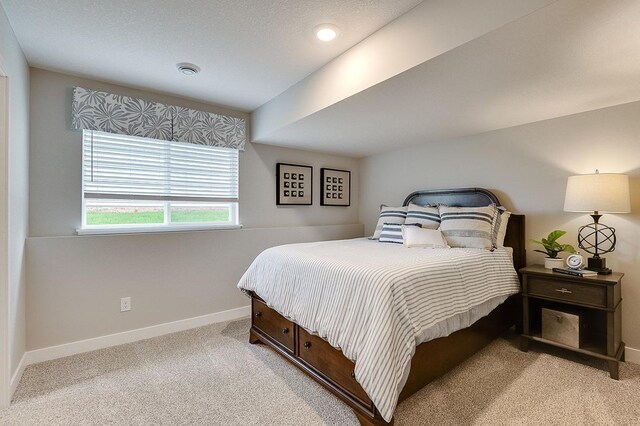 bedroom featuring light carpet