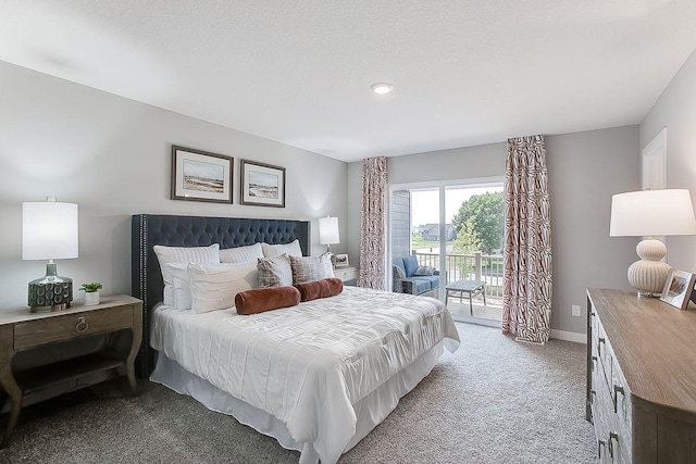 bedroom featuring access to outside, light colored carpet, and a textured ceiling