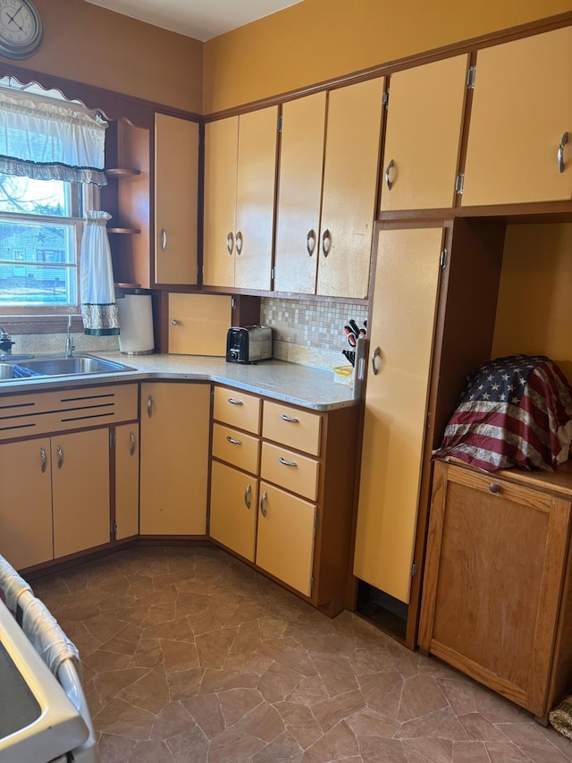 kitchen featuring sink and decorative backsplash