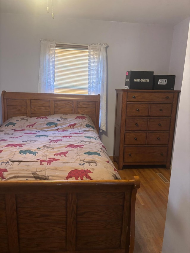 bedroom featuring hardwood / wood-style flooring