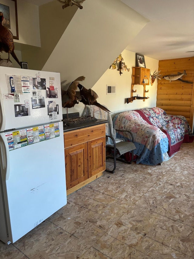 bedroom with white refrigerator