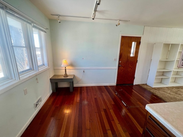 entrance foyer with dark hardwood / wood-style flooring