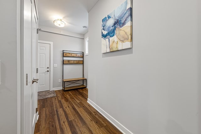 corridor with dark hardwood / wood-style floors