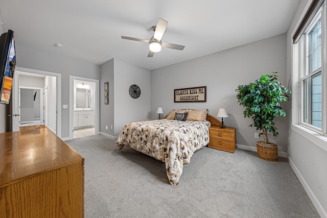 5051 216th St W, Farmington, MN 55024 - carpeted bedroom featuring baseboards, ceiling fan, and connected bathroom