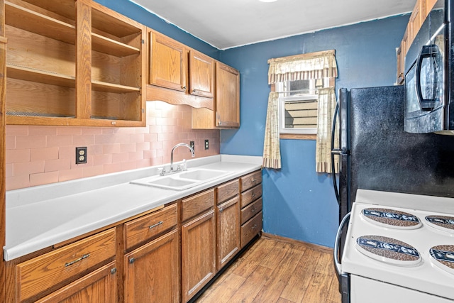 990 Virginia St, Saint Paul, MN 55117 - kitchen featuring black appliances, light wood finished floors, tasteful backsplash, brown cabinets, and light countertops