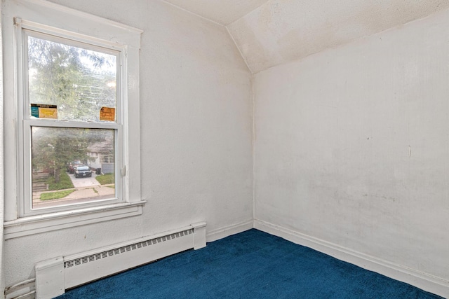990 Virginia St, Saint Paul, MN 55117 - empty room featuring a baseboard heating unit, vaulted ceiling, and dark carpet