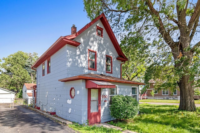 990 Virginia St, Saint Paul, MN 55117 - view of front of house featuring a chimney and an outbuilding