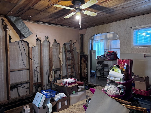 interior space with wooden ceiling and ceiling fan