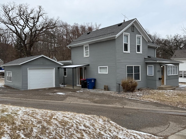 view of front of property featuring an outbuilding and a garage