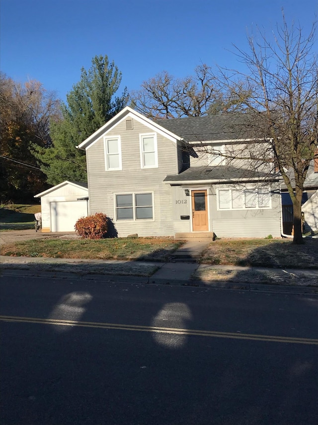 view of front of home featuring an outdoor structure and a garage