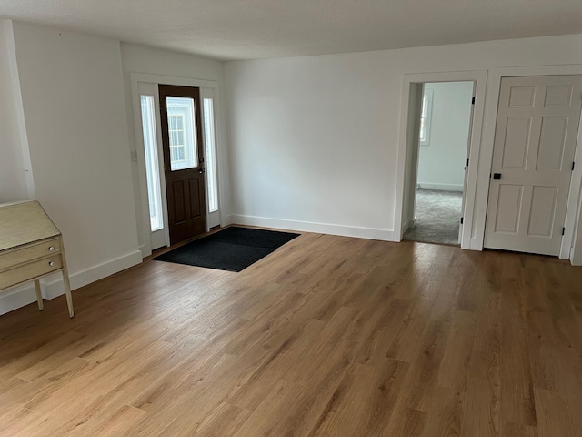 foyer with light wood-type flooring