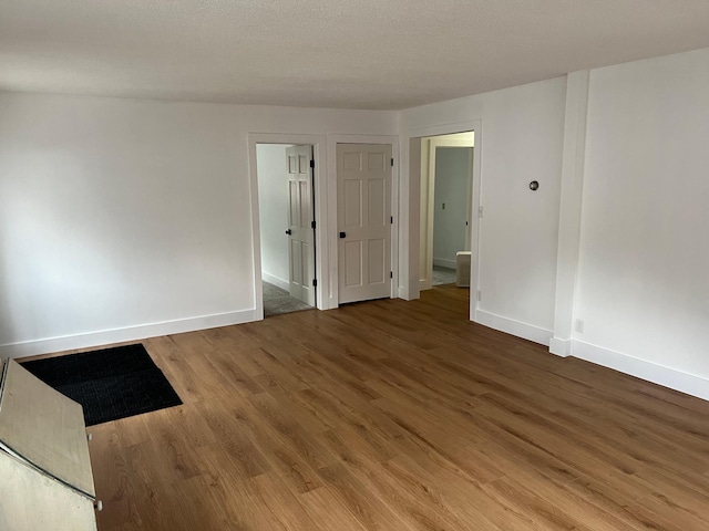 unfurnished room featuring wood-type flooring