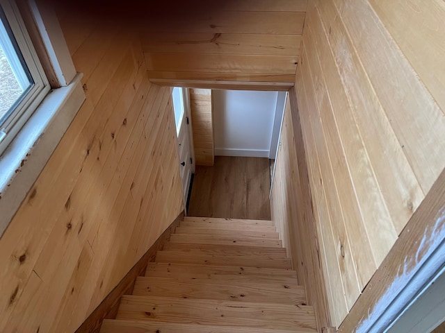 stairway featuring hardwood / wood-style flooring