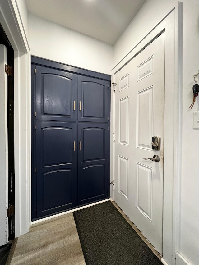 doorway with wood-type flooring