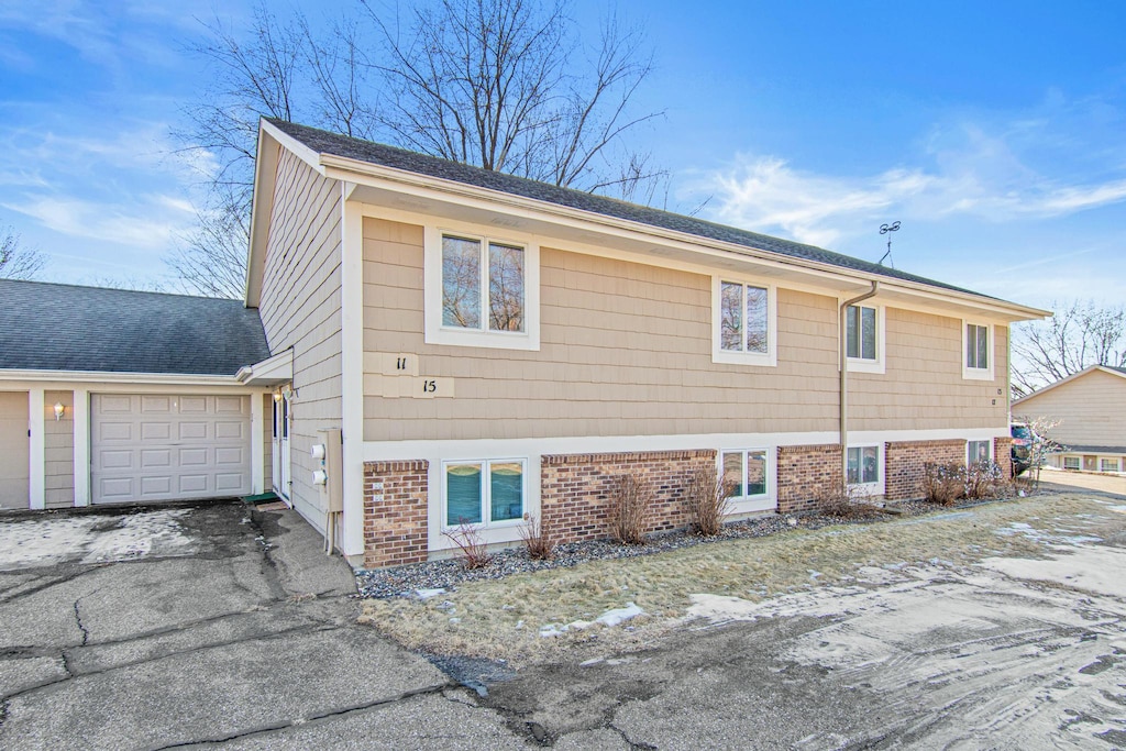 view of side of home featuring a garage