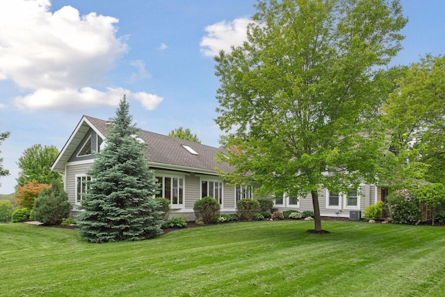 3685 Watertown Rd, Orono, MN 55359 - view of front of home featuring a front yard, roof with shingles, and central air condition unit