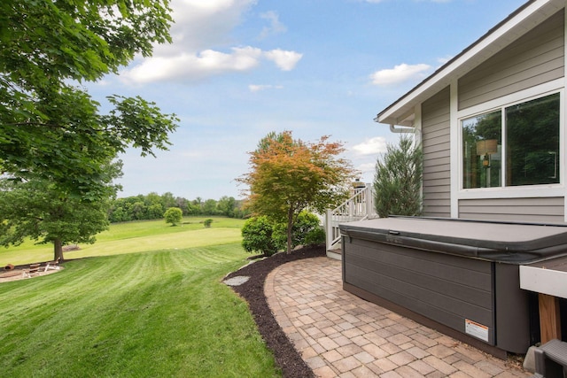 3685 Watertown Rd, Orono, MN 55359 - view of grassy yard featuring a hot tub, a patio area, and golf course view