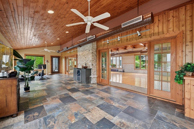 3685 Watertown Rd, Orono, MN 55359 - living room with ceiling fan, wood walls, wine cooler, healthy amount of natural light, and recessed lighting