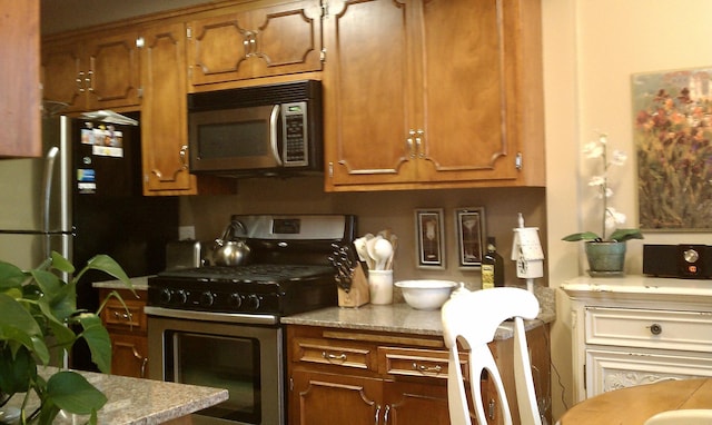 3685 Watertown Rd, Orono, MN 55359 - kitchen featuring stainless steel appliances and brown cabinetry