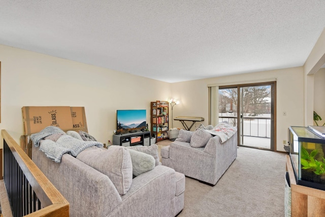 living area featuring light carpet and a textured ceiling