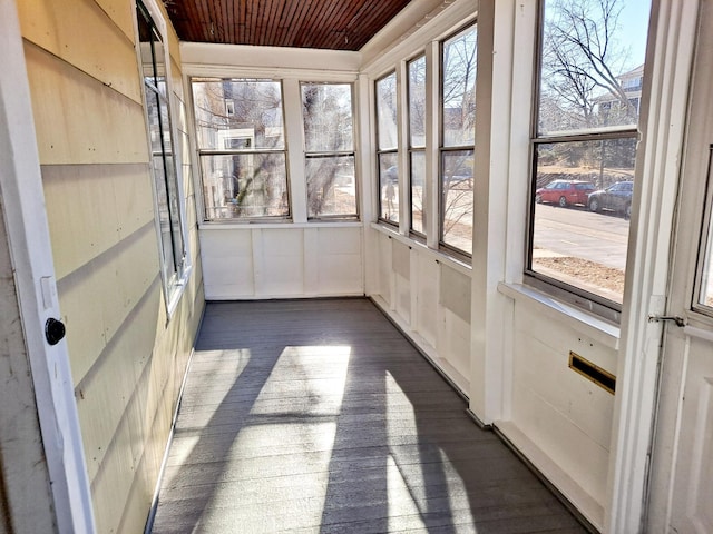 unfurnished sunroom with wood ceiling