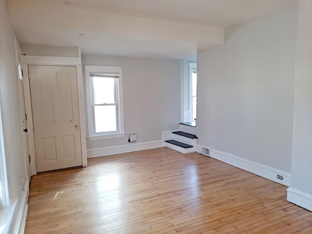 unfurnished room featuring light wood-type flooring