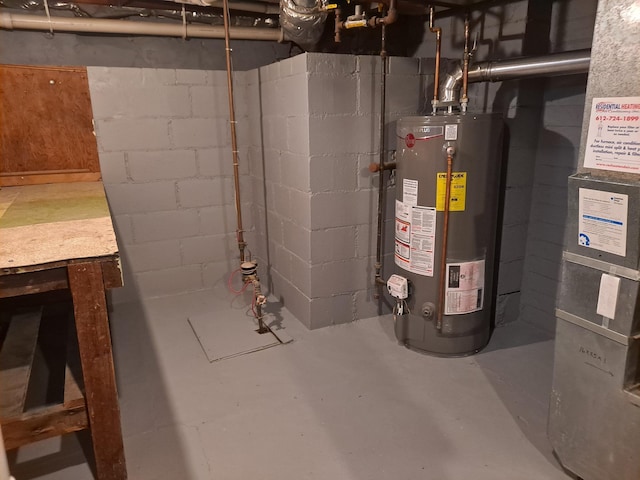 utility room featuring gas water heater and heating unit