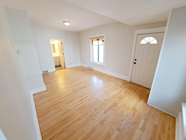 entryway with light hardwood / wood-style floors