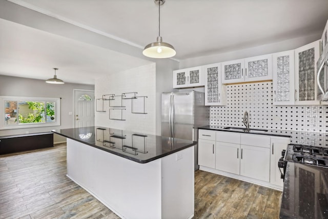 kitchen featuring sink, pendant lighting, white cabinets, and dark wood-type flooring