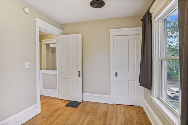 unfurnished bedroom featuring light hardwood / wood-style floors