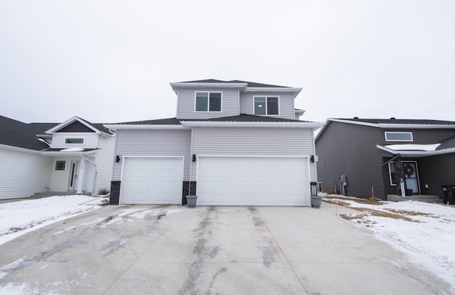 front facade with a garage