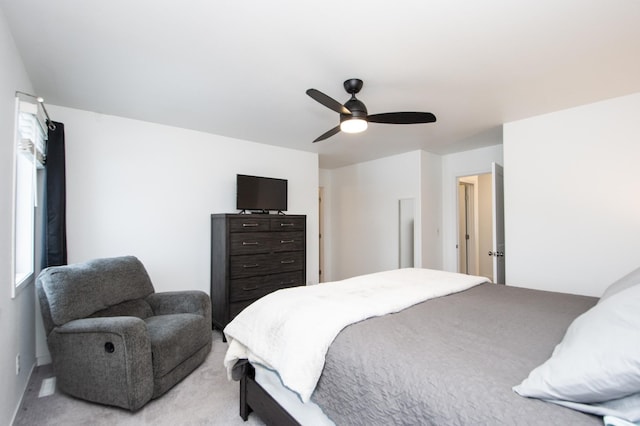 bedroom featuring ceiling fan and light carpet