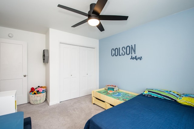 bedroom with light carpet, a closet, and ceiling fan