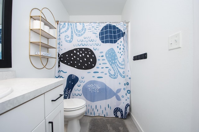 bathroom with vanity, toilet, and walk in shower