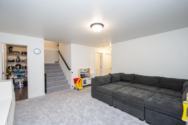 carpeted living room featuring built in features