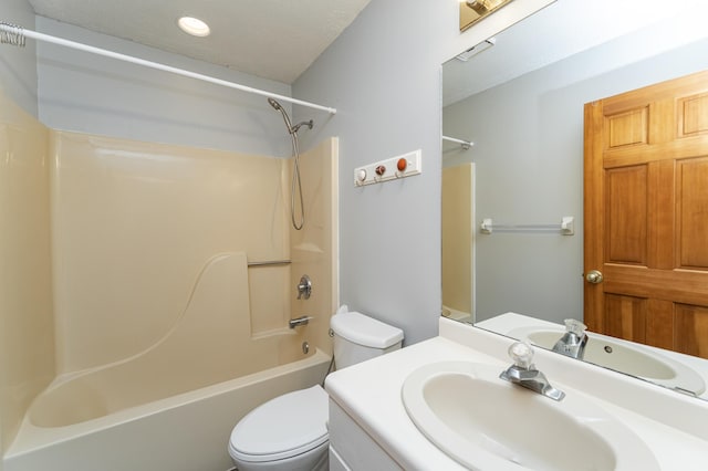 full bathroom with bathing tub / shower combination, vanity, and toilet