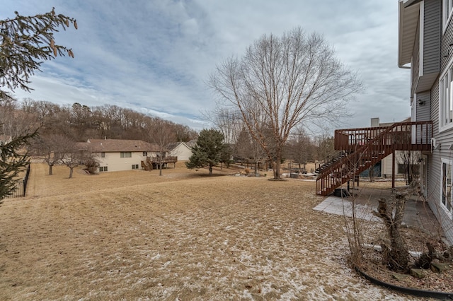 view of yard featuring a wooden deck