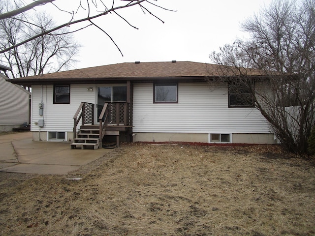 back of property with a patio