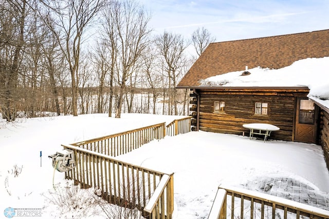 view of snow covered deck