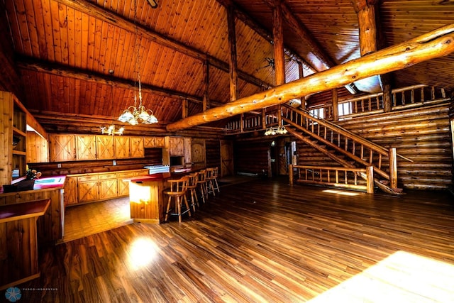 living room featuring wood ceiling, rustic walls, an inviting chandelier, beam ceiling, and wood-type flooring