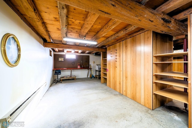 basement featuring a baseboard heating unit and wood ceiling