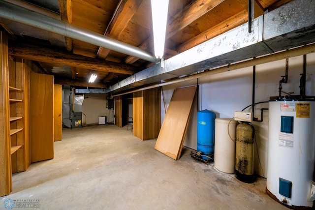 basement featuring heating unit and water heater