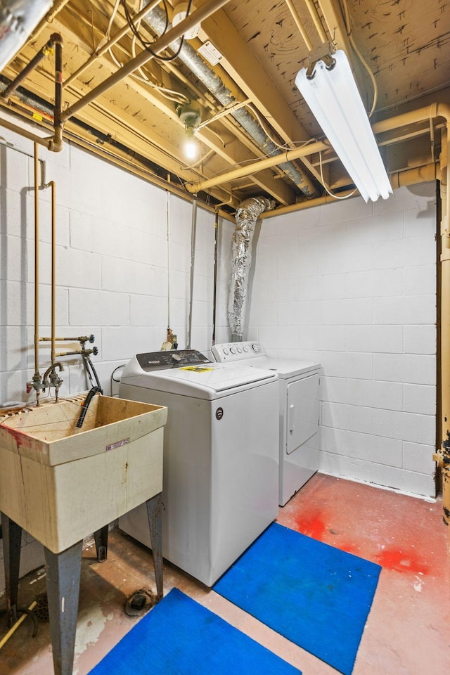 clothes washing area featuring washing machine and clothes dryer