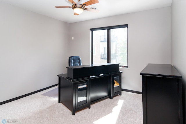 miscellaneous room with ceiling fan and light colored carpet